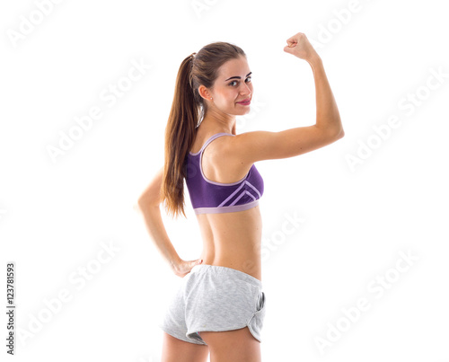 Athletic woman showing her biceps