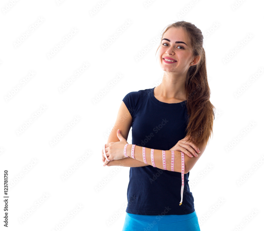 Woman holding centimeter around her arm Woman holding centimeter around her arm