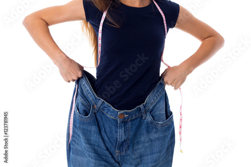 Woman wearing jeans of much bigger size photo