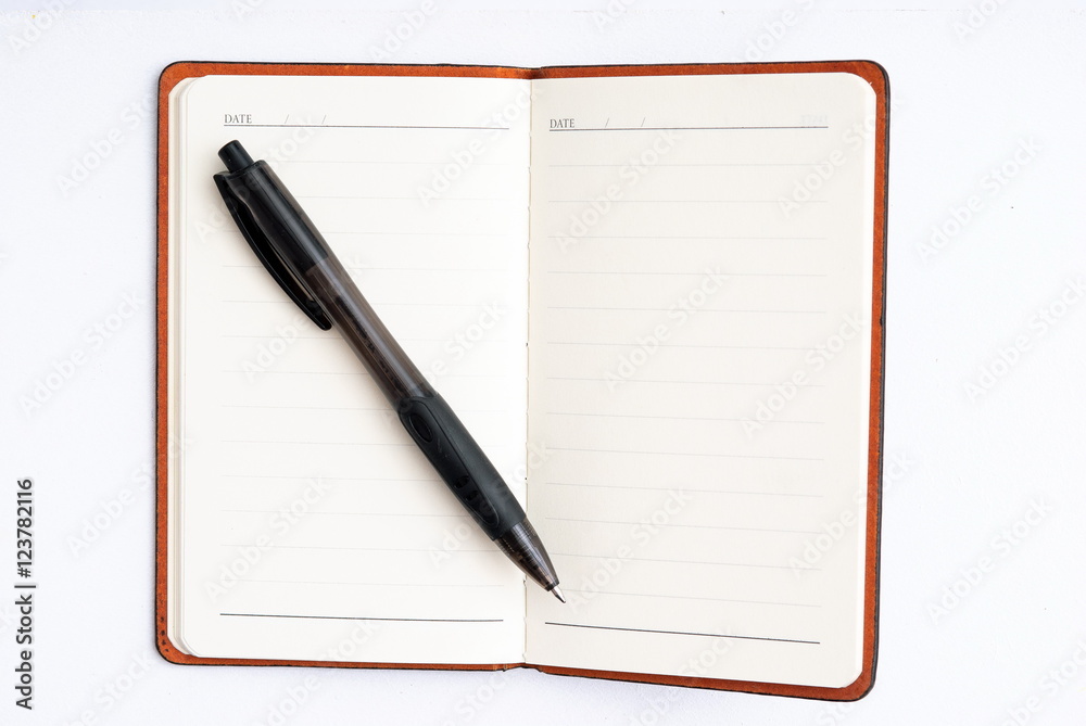 notepad with pen isolated notepad with pen isolated