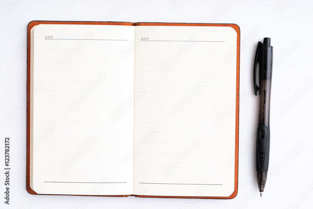 notepad with pen isolated notepad with pen isolated