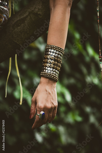ring and massive bracelet on woman hand