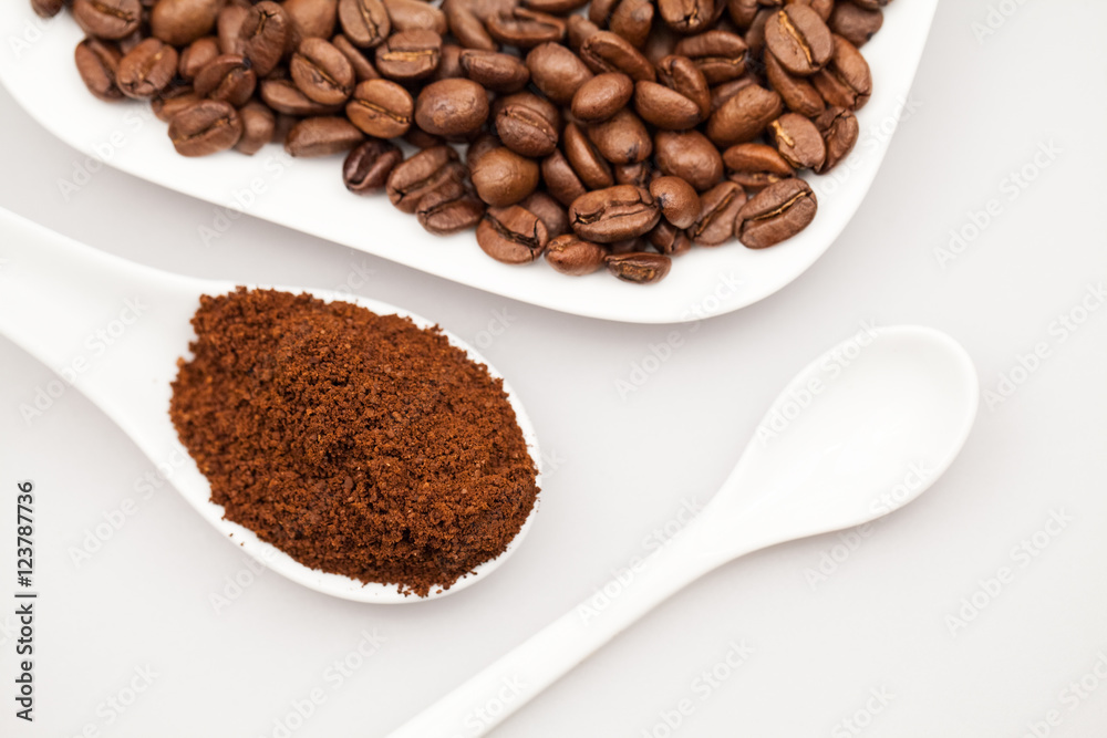 White objects, coffee beans and coffee powder with details White objects, coffee beans and coffee powder with details