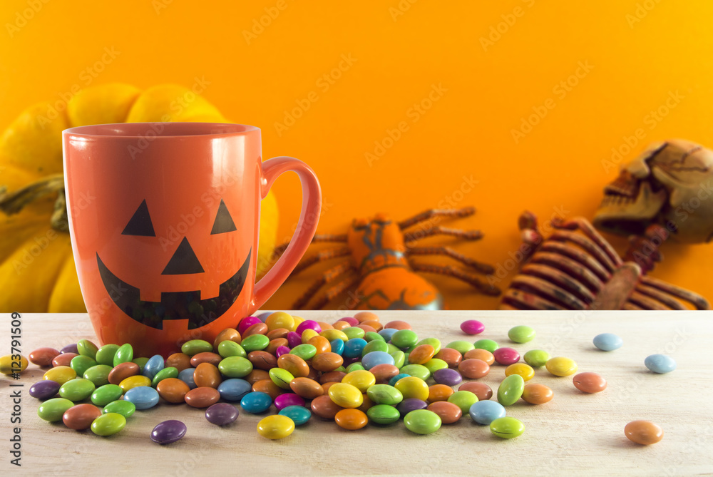 cup and candy on skeleton background cup and candy on skeleton background