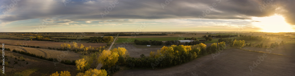Obraz premium Autumn Country Road at Sunset