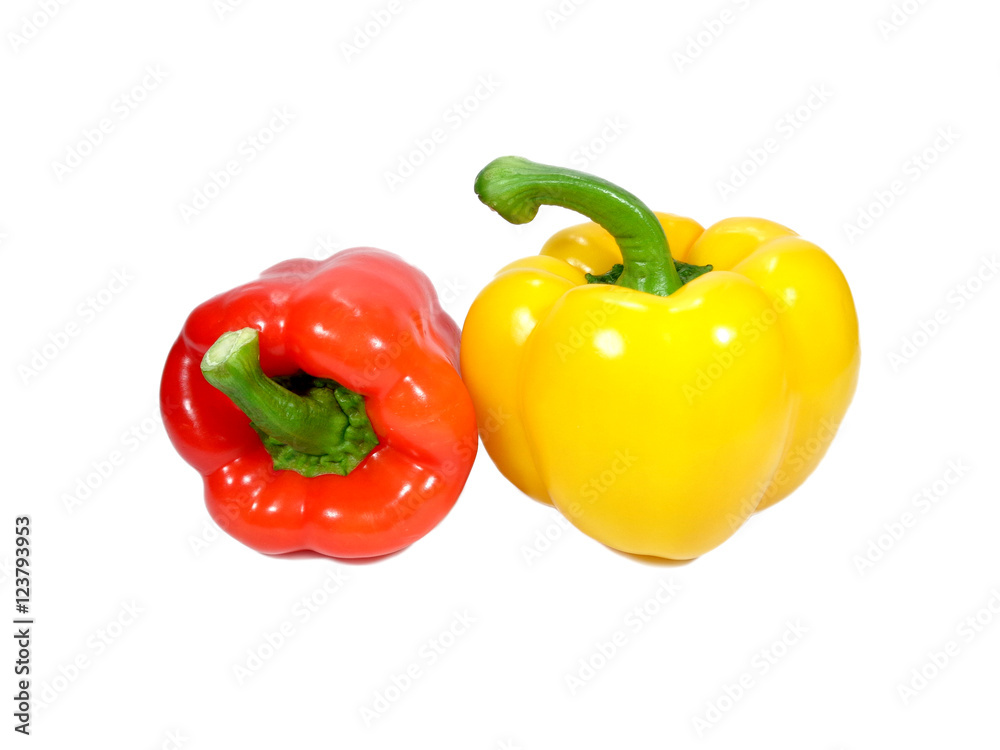 Two ripe bell peppers, one red and one yellow with green stem isolated on white background, close-up Two ripe bell peppers, one red and one yellow with green stem isolated on white background, close-up