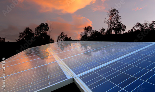 Solar panel with cloudy sky warm