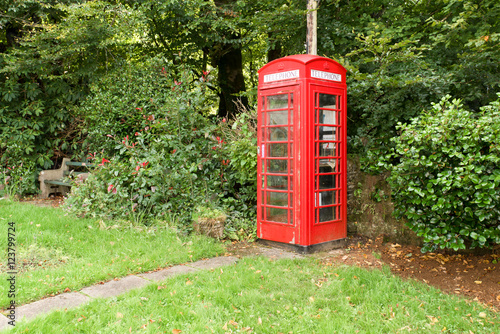 Typical british phone box in the picturesque village Altarnun in Cornwall. photo