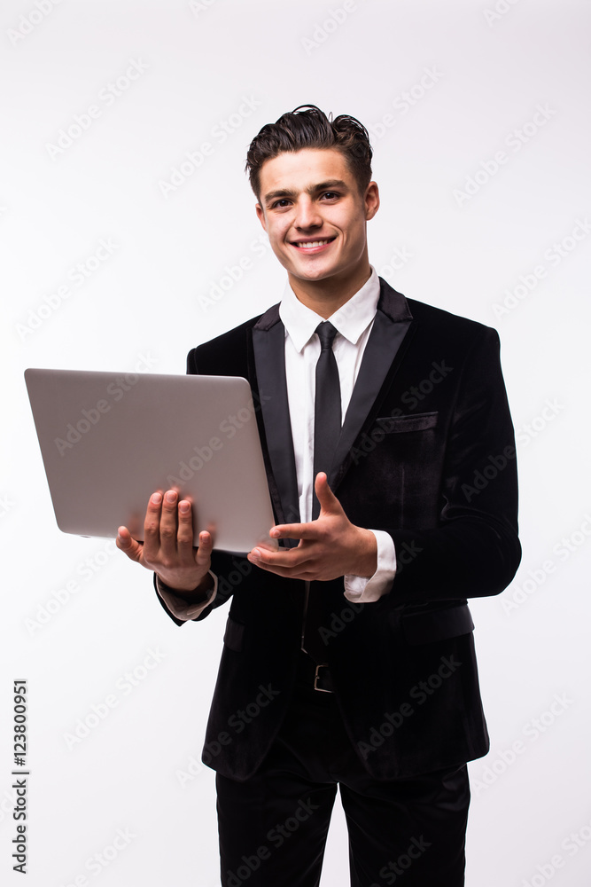 Portrait of smiling young businessman with laptop isolated over white background. Portrait of smiling young businessman with laptop isolated over white background.