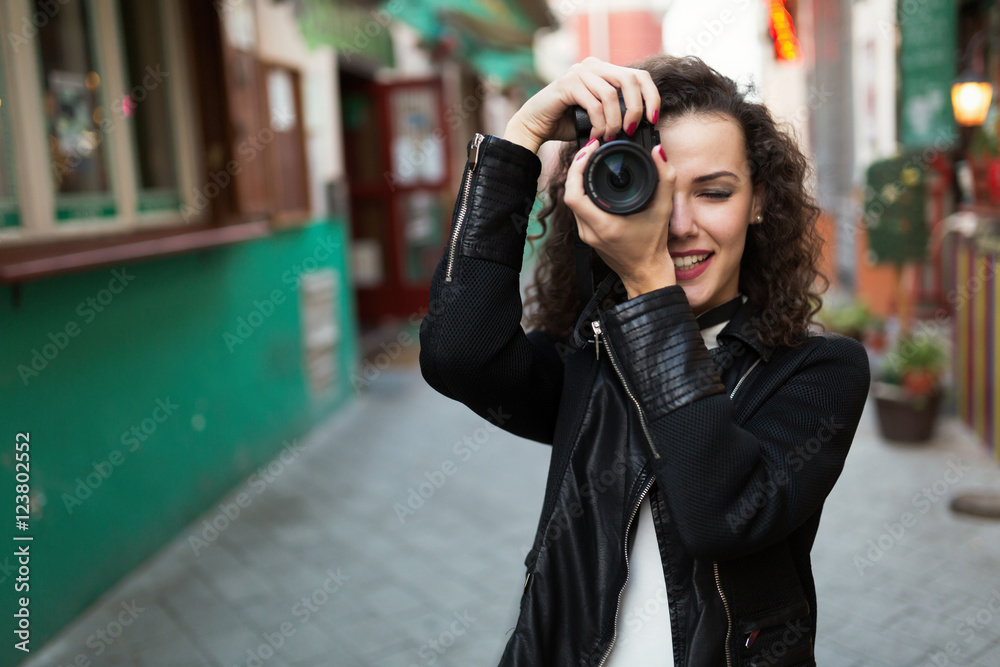 Woman traveling and taking pictures