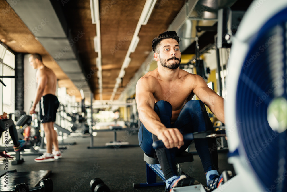 Determined bodybuilder rowing Determined bodybuilder rowing