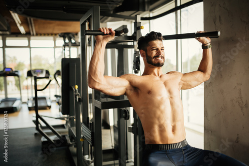 Bodybuilder working out in gym