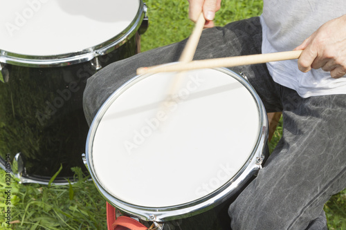 Hands of Drummers Playing Outdoors