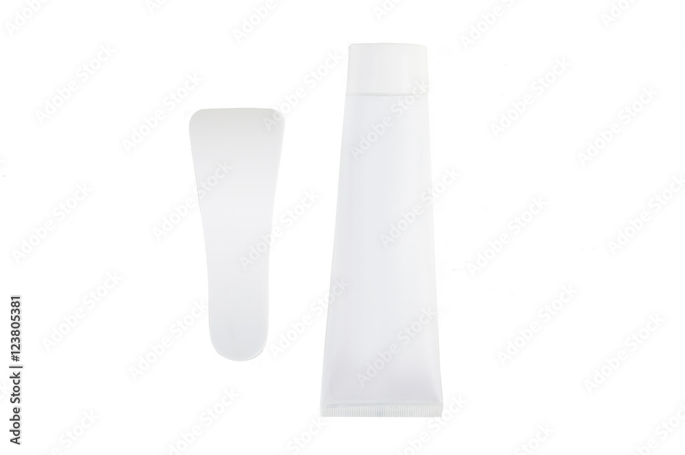 Cream for depilation and spatula to remove. On white, isolated background. Cream for depilation and spatula to remove. On white, isolated background.