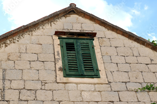 Traditional Mediterranean window on a house in Split, Croatia. Split is popular touristic destination and UNESCO World Heritage Site,
