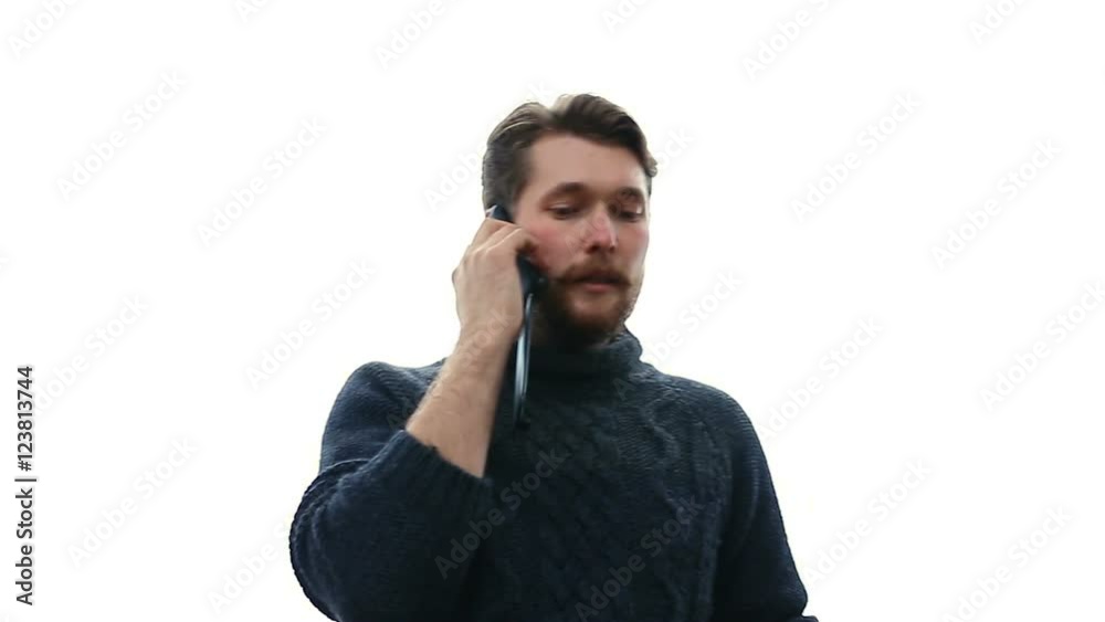 Young and handsome businessman talking on an cell phone. White background Young and handsome businessman talking on an cell phone. White background