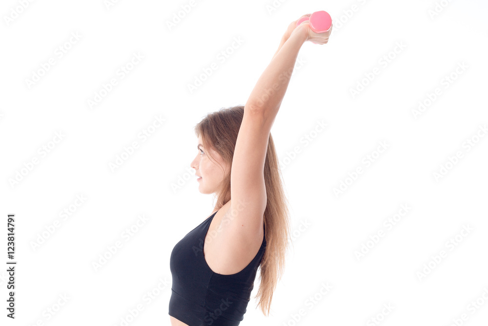 Fitness woman in black sports top holding the dumbbells Fitness woman in black sports top holding the dumbbells