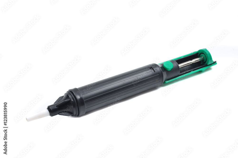 Solder sucker or syringe for suctioning the solder on a white background Solder sucker or syringe for suctioning the solder on a white background