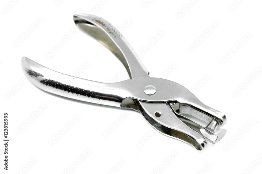 Silver metallic hole puncher on white background Silver metallic hole puncher on white background