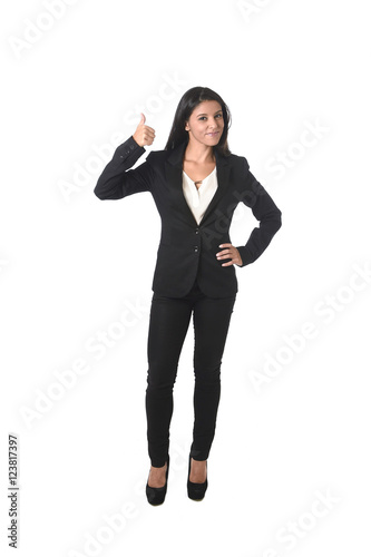 corporate portrait of young attractive latin businesswoman in office suit smiling happy
