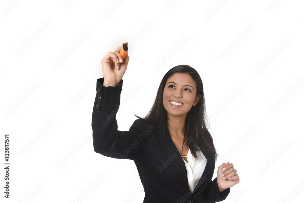latin businesswoman in office suit writing with marker on invisible virtual screen or board latin businesswoman in office suit writing with marker on invisible virtual screen or board