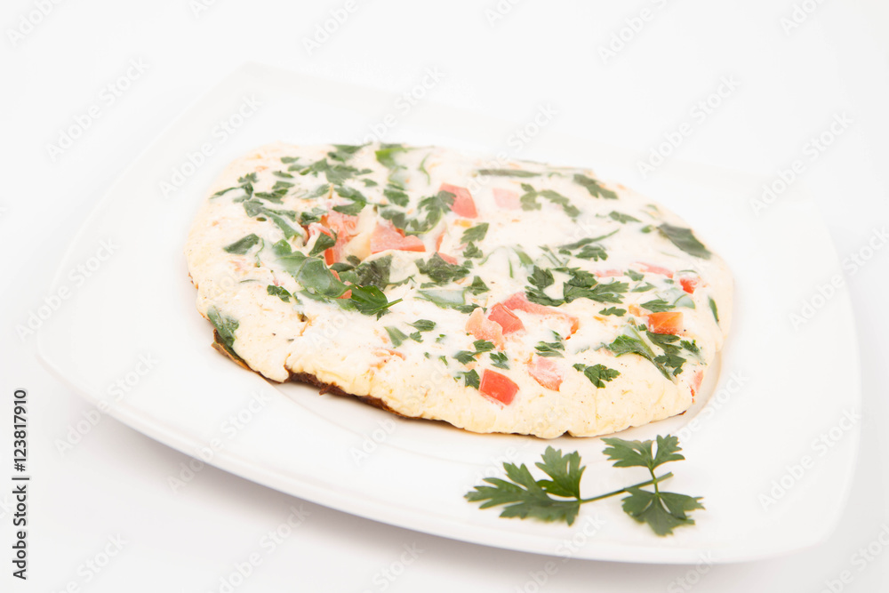 Omelette with tomatoes, fresh spinach and parsley Omelette with tomatoes, fresh spinach and parsley