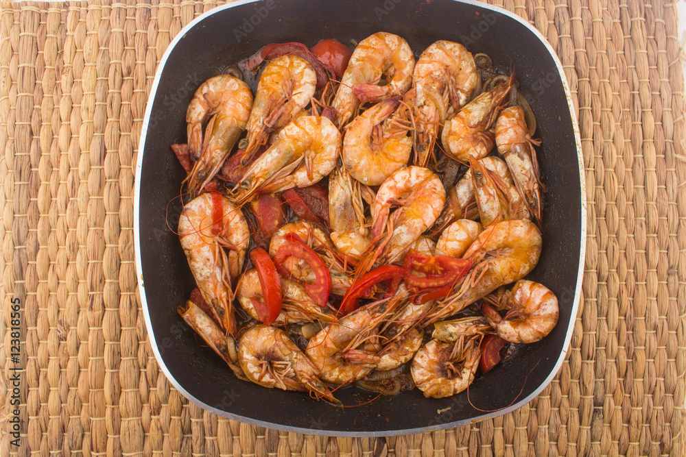 Cooked Fresh Shrimp with Tomato and Onions / Cooked Fresh Shrimp with Tomato and Onions Served in a plate on a Wooden ( Black Ceramic) background Cooked Fresh Shrimp with Tomato and Onions / Cooked Fresh Shrimp with Tomato and Onions Served in a plate on a Wooden ( Black Ceramic) background