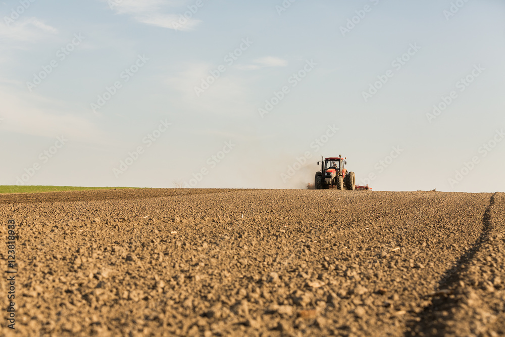 Close up shot of seedbed cultivator machine at work Close up shot of seedbed cultivator machine at work