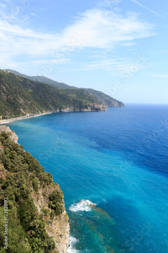 Rocky coast and Cinque Terre village Manarola and Mediterranean Sea, Italy © johannes86