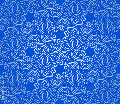 Twisted and wavy snowflakes seamless ornament on a blue background. Abstract seamless texture.