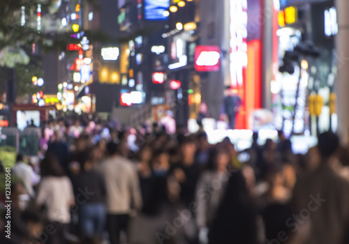 Crowd of people moving on the night street in Seoul - south Korea -  blurred abstract image