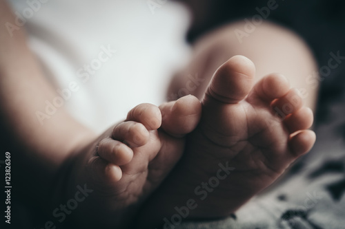 White newborn tiny baby feet