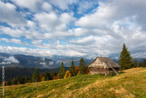 Landscape. Autumn day in the mountains. Carpathians. House in the valley.