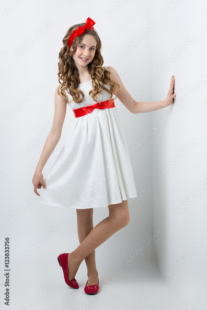 Teen girl with red bow on head Teen girl with red bow on head