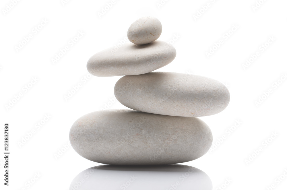 Balanced pebbles, isolated on white background with reflection Balanced pebbles, isolated on white background with reflection