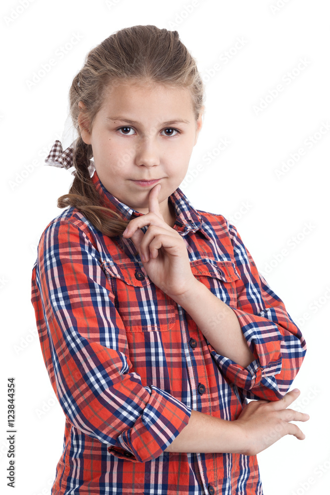 Portrait of thinking an eight-year girl in a red checkered shirt, isolated white background Portrait of thinking an eight-year girl in a red checkered shirt, isolated white background