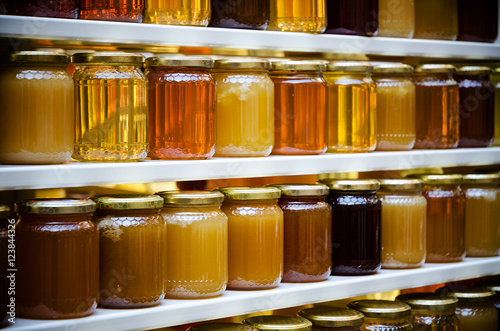 honey jars on a shelf photo