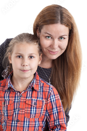 Close up portrait of young mother with her daughter, isolated on white background