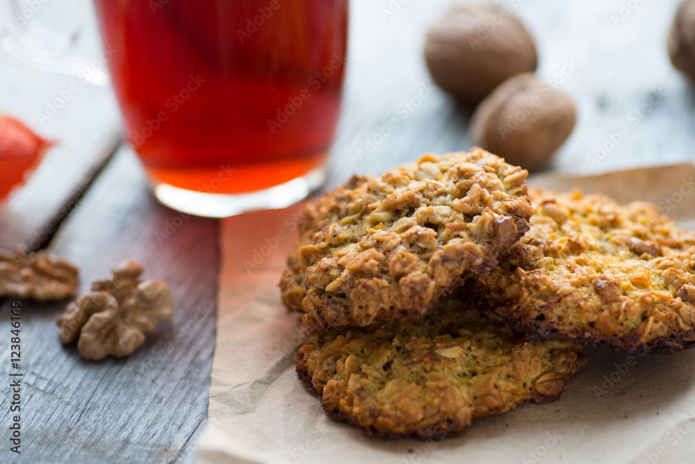 Homemade oatmeal cookies served with cup of tea Homemade oatmeal cookies served with cup of tea