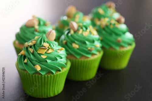 Wallpaper Mural Pistachio cupcakes on dark background Torontodigital.ca
