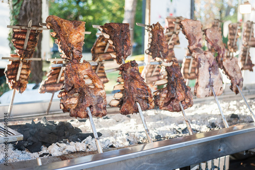 Traditional Argentinian asado roasted lamb grilled meat. photo