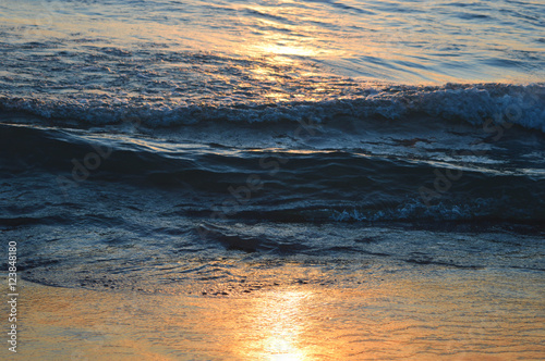 Brilliant sunrise over the waters of lake Huron in Oscoda, Michigan photo