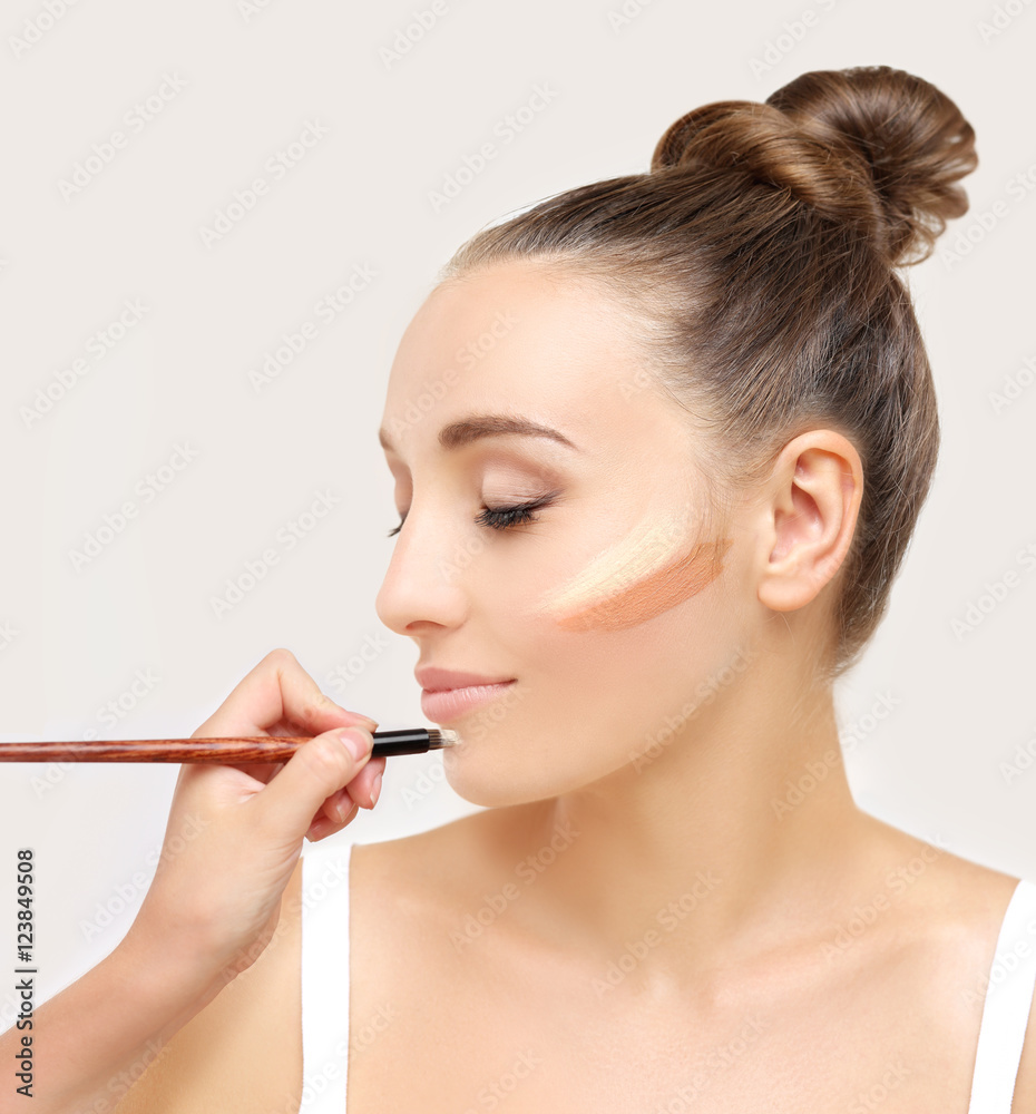 Putting makeup .Contouring.Make up woman face. Contour and highlight makeup. Putting makeup .Contouring.Make up woman face. Contour and highlight makeup.