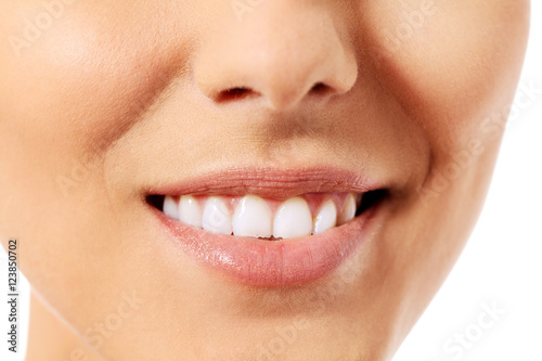 Healthy woman teeth and smile. Isolated over white background