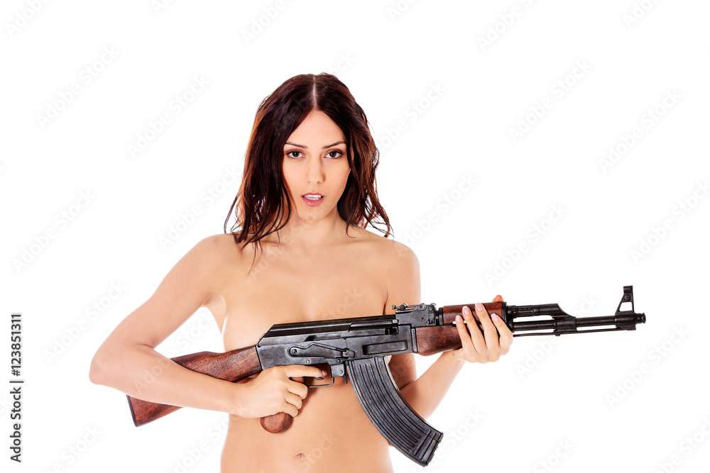 Sexy nude brunette girl model with weapon. Sexy nude brunette girl model with weapon.