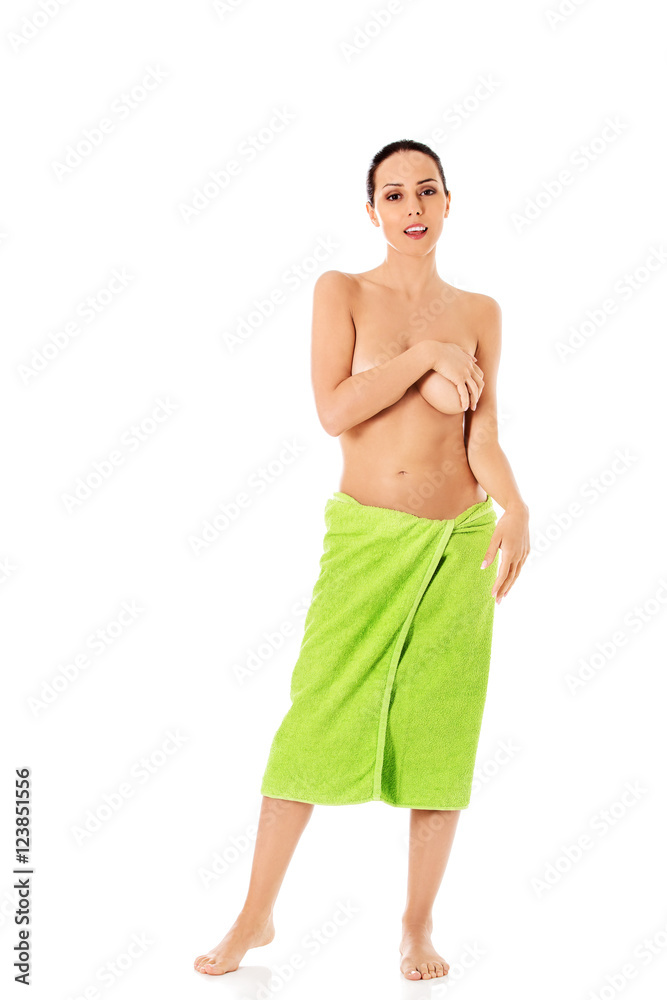 Fototapeta premium Young beautiful woman after bath full portrait isolated over white.