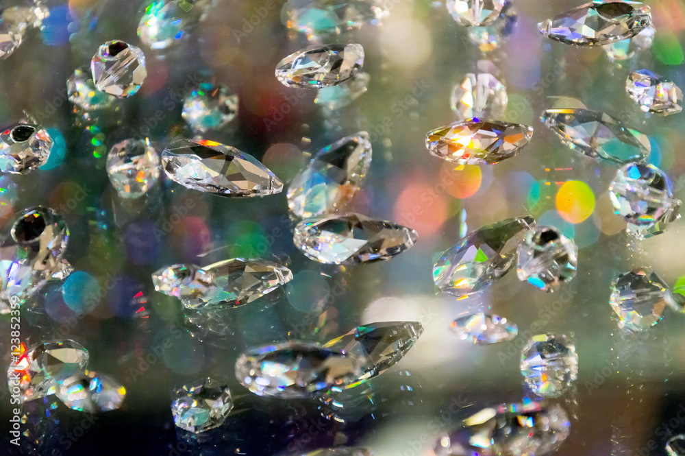 Large crystal strasses on a blur colored background. low depth of field.