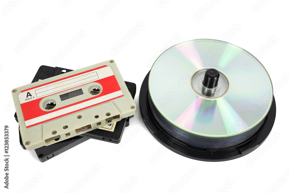 Audio cassettes and CDs on white background Audio cassettes and CDs on white background