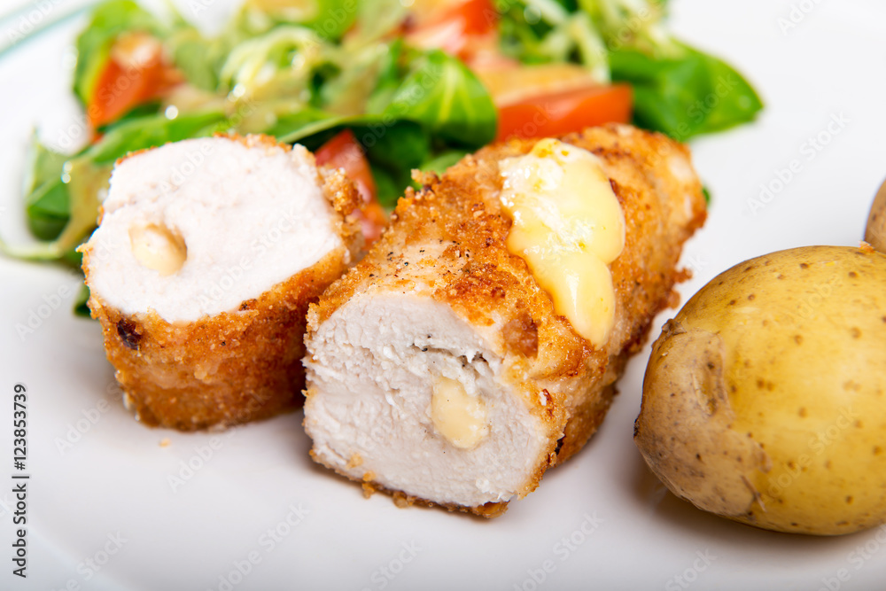 Kiev cutlet with jacket potatoes and salad Kiev cutlet with jacket potatoes and salad