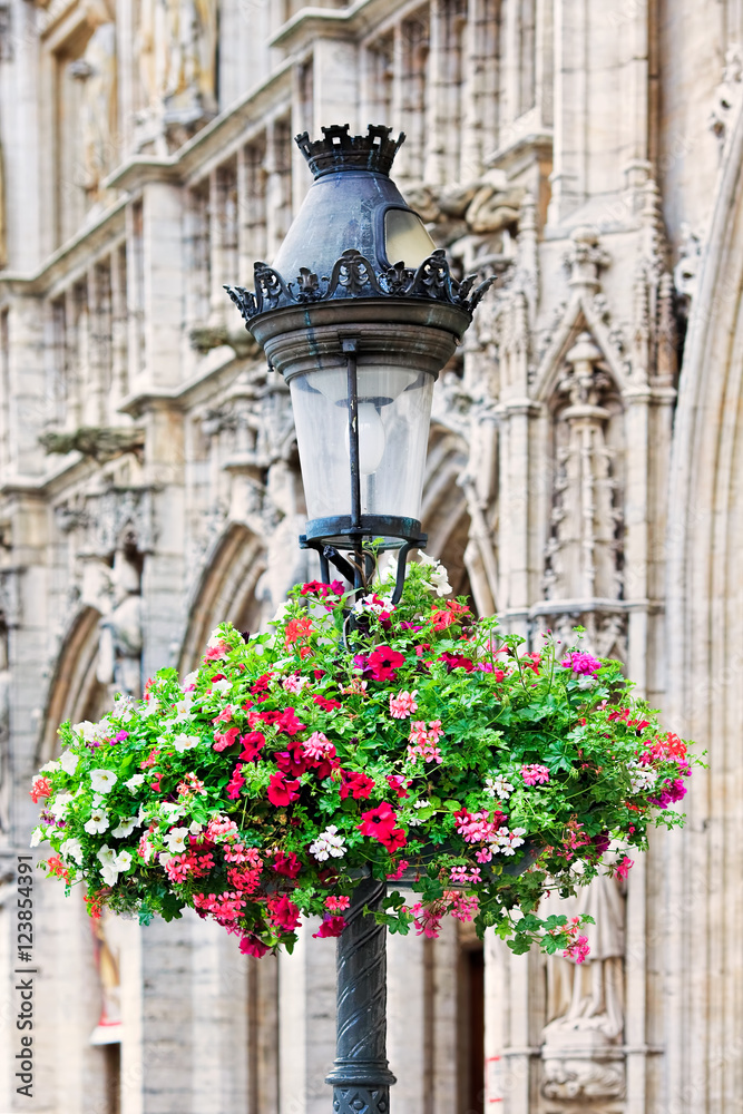 Vintage lantern with a fresh flower bouquet; Brussels, Belgium